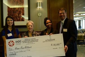 IADC Houston Chapter members present a check to Home Run Hitters International  Left to Right: Allison Fraser, Rowan; Marcy Sandell; Dr. Deborah Carr, TITLE at Home Run Hitters and Scott Gordon, Derrick Equipment. 