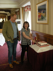 Edith McLeod, current NSC Administrator and Pete Wilson, current NSC Chairman, cut the 45th anniversary cake during the 18 May gathering of current and former IADC North Sea Chapter members. 